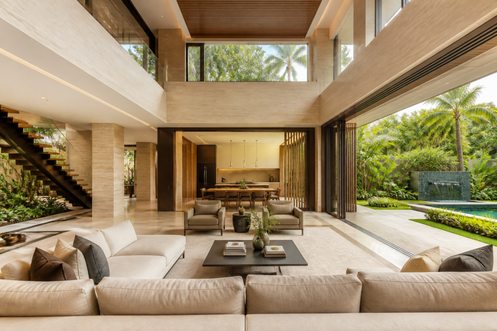 Renovated Singapore bungalow interior with double-height living room and tropical garden